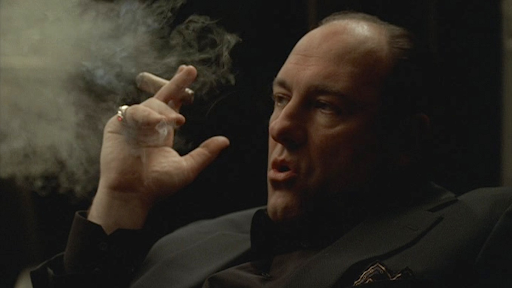 Image of Tony Soprano smoking a cigar. Screenshot from "The Sopranos," HBO