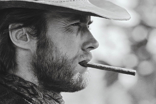 Clint Eastwood enjoying a cigar.