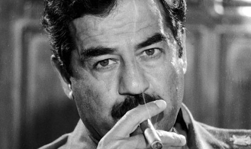 Portrait of Saddam Hussein with a cigar