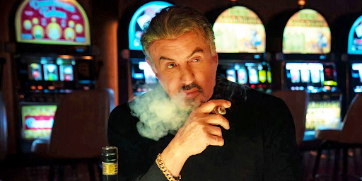 Sylvester Stallone smoking a Cigar in a Casino